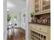 Dining nook with built in wine rack and shelves, and eat-in dining room with natural light through large windows at 4381 Laurian Nw Dr, Kennesaw, GA 30144