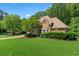 Beautiful home with mature landscaping, a well-maintained lawn, and an inviting curb appeal at 4381 Laurian Nw Dr, Kennesaw, GA 30144