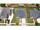 Aerial view of home with a well-manicured lawn and driveway, surrounded by other homes in a neighborhood at 675 Mallard Cv, Loganville, GA 30052