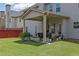 Backyard featuring a covered patio and lush green lawn, perfect for outdoor living at 675 Mallard Cv, Loganville, GA 30052