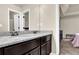 Granite-topped vanity with double sinks in a modern bathroom at 675 Mallard Cv, Loganville, GA 30052