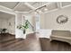 Spacious dining area featuring hardwood floors, neutral walls, and stylish lighting at 675 Mallard Cv, Loganville, GA 30052
