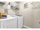 Functional laundry room with modern washer and dryer at 675 Mallard Cv, Loganville, GA 30052