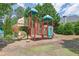 Community playground with multiple slides, climbing structures, and seating, great for Gathering fun at 675 Mallard Cv, Loganville, GA 30052