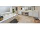Bathroom features a soaking tub, double vanities, and vanity seating at 7025 Coffield Ct, Cumming, GA 30041