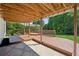 A large wooden deck with railing provides ample space to entertain and enjoy the backyard at 7025 Coffield Ct, Cumming, GA 30041