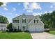 Charming two-story home with a well-manicured lawn and attached two-car garage at 7025 Coffield Ct, Cumming, GA 30041
