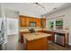 A charming kitchen boasts granite countertops, stainless steel appliances, and custom cabinetry at 7025 Coffield Ct, Cumming, GA 30041