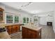 The stylish kitchen overlooks the living room and features stainless appliances and a center island at 7025 Coffield Ct, Cumming, GA 30041