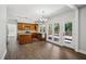 A gorgeous kitchen boasts stainless appliances and opens to a large deck via a glass patio door at 7025 Coffield Ct, Cumming, GA 30041