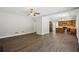 Open concept living room and kitchen with hardwood floors and stainless steel appliances at 7025 Coffield Ct, Cumming, GA 30041