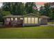 Spacious backyard with a wooden deck and ample green space at 905 Scott Sw Ln, Marietta, GA 30008