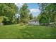 Expansive backyard with full fencing, lush lawn, and mature trees at 905 Scott Sw Ln, Marietta, GA 30008