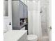 This bathroom offers a shower with marble tile, a vanity cabinet and great lighting at 905 Scott Sw Ln, Marietta, GA 30008
