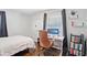 Inviting bedroom features a dedicated workspace, hardwood floors, and ample natural light at 905 Scott Sw Ln, Marietta, GA 30008