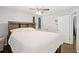 Spacious bedroom featuring a ceiling fan, and a crib, with hardwood floors at 905 Scott Sw Ln, Marietta, GA 30008
