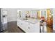 Open floor plan featuring a large island, stainless appliances, granite countertops, and dark hardwood floors at 905 Scott Sw Ln, Marietta, GA 30008