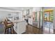 Modern kitchen with stainless appliances, center island, and adjacent sunroom, creating a bright and open space at 905 Scott Sw Ln, Marietta, GA 30008