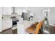 Modern kitchen boasts stainless appliances, granite counters, a breakfast bar, and updated cabinets at 905 Scott Sw Ln, Marietta, GA 30008