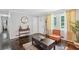 Inviting living room with stylish furnishings, hardwood floors, and large windows with bright natural light at 905 Scott Sw Ln, Marietta, GA 30008