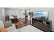Open-concept living area flowing into the kitchen, featuring hardwood floors and modern amenities at 905 Scott Sw Ln, Marietta, GA 30008