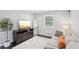 Comfortable living space featuring a modern media center, soft rug, and inviting seating at 905 Scott Sw Ln, Marietta, GA 30008