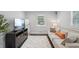 Bright living room with a media center, soft rug, and inviting seating at 905 Scott Sw Ln, Marietta, GA 30008
