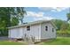 Detached shed provides versatile storage and workspace, complementing the lush green surroundings at 905 Scott Sw Ln, Marietta, GA 30008