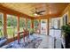 This sunroom features wood walls, lots of natural light, and room for a desk and chair at 905 Scott Sw Ln, Marietta, GA 30008