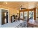 This sunroom features wood walls, lots of natural light, and room for a desk and chair at 905 Scott Sw Ln, Marietta, GA 30008