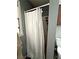 Bathroom showing a bathtub shower with a white shower curtain and a sink at 224 Potts Se Rd, Conyers, GA 30094