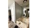 Bathroom featuring a vanity, jetted tub, and tile flooring at 224 Potts Se Rd, Conyers, GA 30094