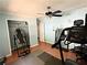 Bedroom features an open closet, ceiling fan and fitness equipment at 224 Potts Se Rd, Conyers, GA 30094