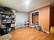 Bedroom with wood flooring, an open closet and neutral tones at 224 Potts Se Rd, Conyers, GA 30094