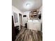Laundry room with washer, dryer, hooks, a utility sink, and wood flooring at 224 Potts Se Rd, Conyers, GA 30094