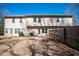 A spacious backyard view of the house, trees, and fence on a sunny day at 2544 Castellan Dr, Atlanta, GA 30316