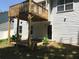 Photo of a backyard with deck above and patio, ready for outdoor enjoyment and entertaining at 318 Summit View Dr, Mcdonough, GA 30253