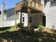 Backyard features a deck above and a patio space, ideal for outdoor entertaining and dining at 318 Summit View Dr, Mcdonough, GA 30253