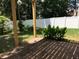 Outdoor patio features brick pavers, a covered deck above, and lush greenery, offering privacy and shade at 318 Summit View Dr, Mcdonough, GA 30253