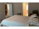 Bedroom with neutral walls and multiple entry doors to the kitchen and bathroom at 318 Summit View Dr, Mcdonough, GA 30253