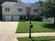 Traditional two-story home with a well-manicured front yard and a two-car garage at 318 Summit View Dr, Mcdonough, GA 30253