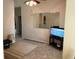 This living room has a nice lamp, rug, and television at 318 Summit View Dr, Mcdonough, GA 30253