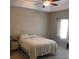 This main bedroom offers a ceiling fan and side table at 318 Summit View Dr, Mcdonough, GA 30253