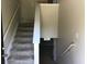 Well-lit staircase leading to the upper level of the home at 318 Summit View Dr, Mcdonough, GA 30253