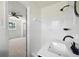 Bathroom with white tiled shower, view into the bedroom, and black hardware at 4172 N Martin Way, Lithia Springs, GA 30122