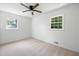 Bright bedroom with neutral carpet, ceiling fan, and natural light from the double windows at 4172 N Martin Way, Lithia Springs, GA 30122