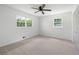 Bright bedroom with neutral carpet, ceiling fan, and natural light from the double windows at 4172 N Martin Way, Lithia Springs, GA 30122