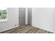 An empty bedroom with neutral paint, modern floors and gray doors at 4172 N Martin Way, Lithia Springs, GA 30122