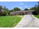 Charming one-story brick home featuring a well-manicured lawn, attached carport, and inviting curb appeal at 4172 N Martin Way, Lithia Springs, GA 30122