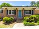A front entrance with a bright blue door and brick facade with brown columns at 4172 N Martin Way, Lithia Springs, GA 30122